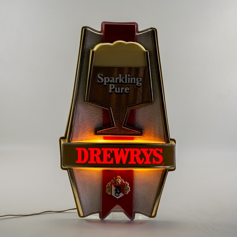 Drewrys Sparkling Pure Lighted Advertisement: Vintage Drewrys "Sparkling Pure" lighted advertising sign. Plugs in and lights up. Overall good condition with light scratches, minor paint loss, and small crack under "Drewrys". See pictures and bid 