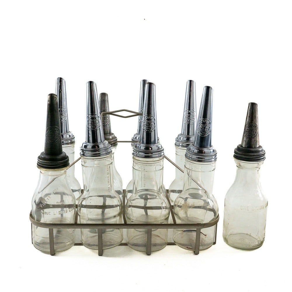 9 Vintage Glass Motor Oil Bottles & Metal Carrier: 9 vintage 1 quart glass motor oil bottles with metal Master Mfg. spouts. All in VG condition. Comes with a metal carrying rack that holds 8 bottles.