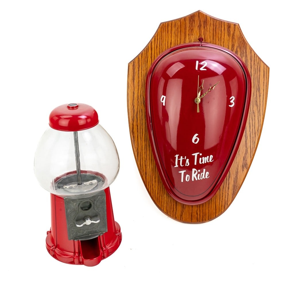 Contemporary Gumball Machine/ Custom Scooter Clock: First, a contemporary replica of a vintage glass globe gumball machine. Coin operated in very good condition. 14.5"H x 8.5"W. Second, a custom clock on oak wall plaque. My guess it is an old scooter o