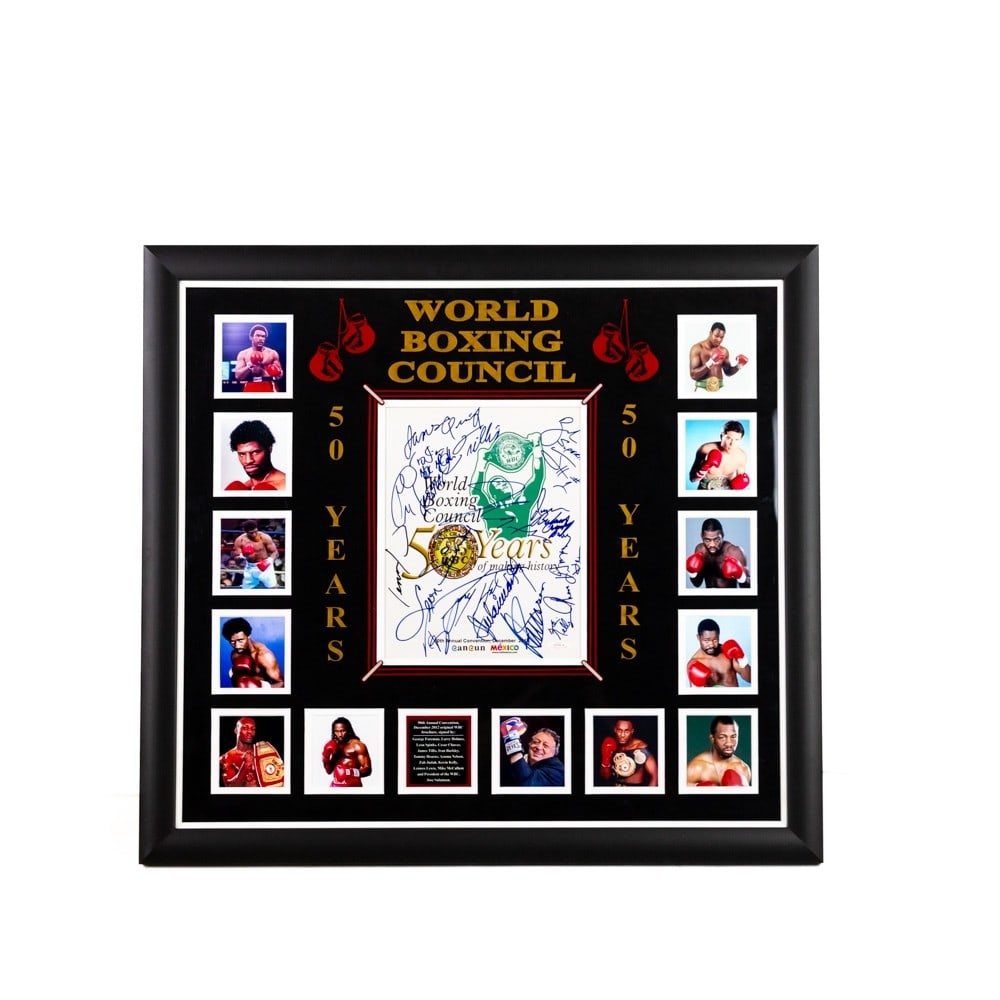 Foreman, Holmes, Spinks - WBC World Boxing Council: WBC 50th Anniversary December 2012 brochure with multiple photographs and signatures. George Foreman, Leon Spinks, Larry Holmes, Cesar Chavez, James Tillis, Iran Barkley, Tommy Hearns, Azuma Nelson, Z