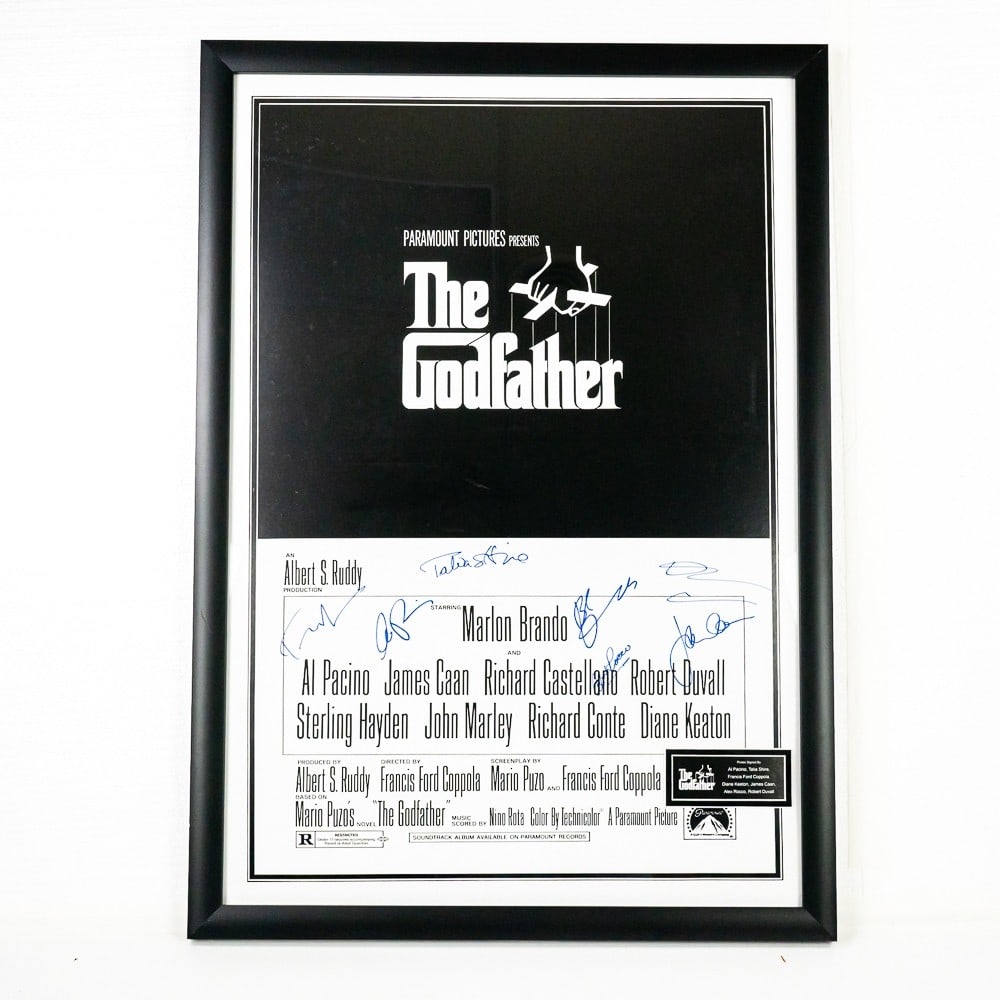 "The Godfather" Lobby Poster: Lobby poster with signatures of Al Pacino, Talia Shire, Francis Ford Coppola, Diane Keeton, James Caan, Alex Rocco and Robert DuVall. A COA issued by Authentic Autographs Unlimited included. 8 7/8" X