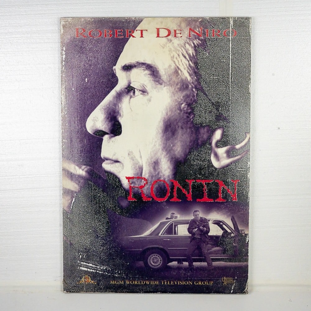"Ronin" Movie Poster Robert De Niro: 27" X 40" Mounted on art board without frame. Fair condition with color and image loss. Please review all photos as they are a part of this description. Note: Donley Auctions does not warranty any thi