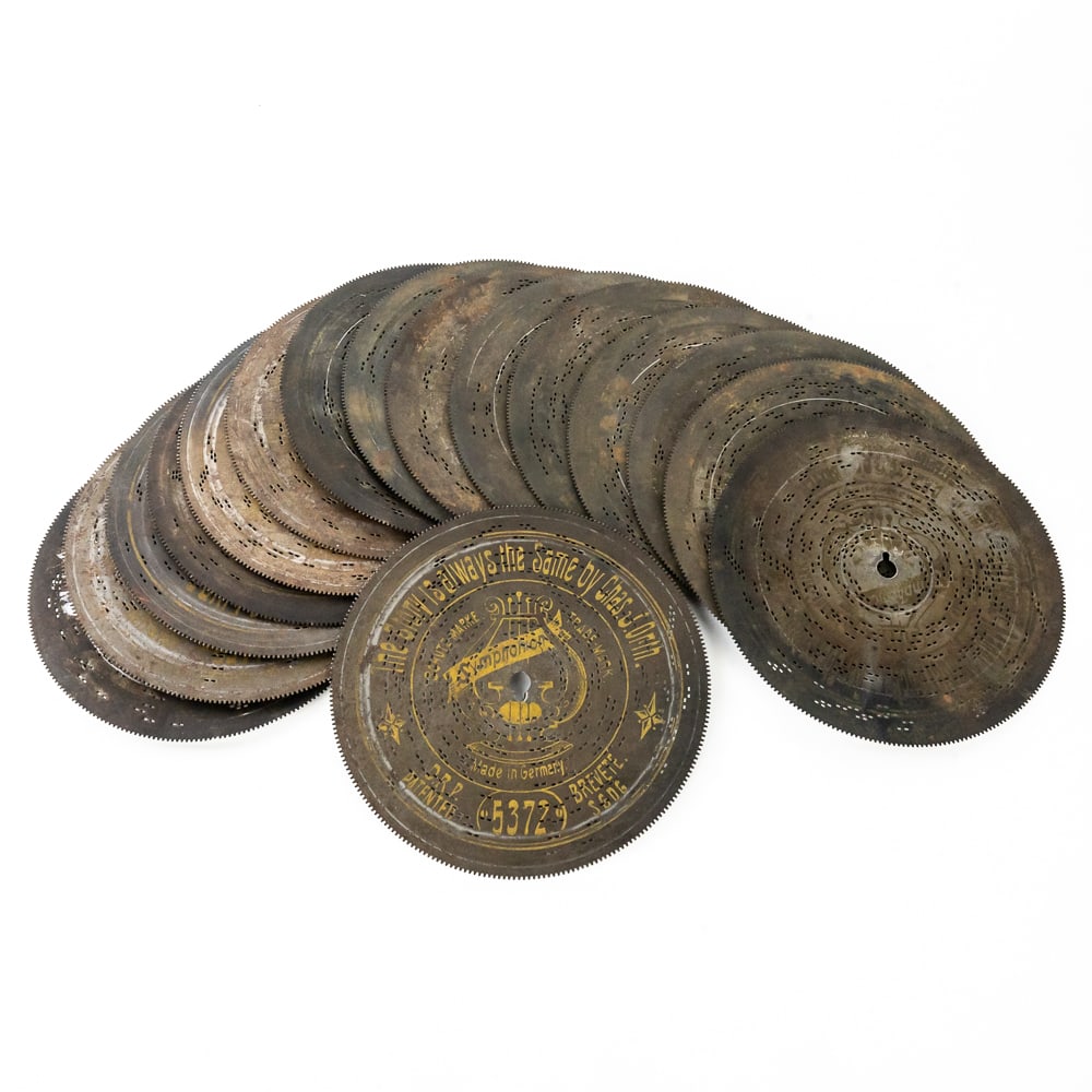 16 Symphonion 5 3/4" Saw Tooth Music Box Discs: In good condition, includes: The Story is Always the Same, multiple German titles, and more - see photos.