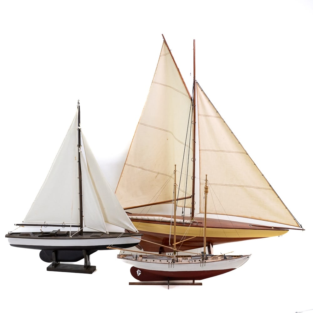 (3) Wooden Model Sail Boats: *NO SHIPPING - PICKUP OR THIRD PARTY TRANSPORT ONLY* Lot of 3 boats includes: Large pond sail boat 42" long, 40" tall on stand with cloth sails, a model 24" long, 29" tall on stand with cloth sails, a