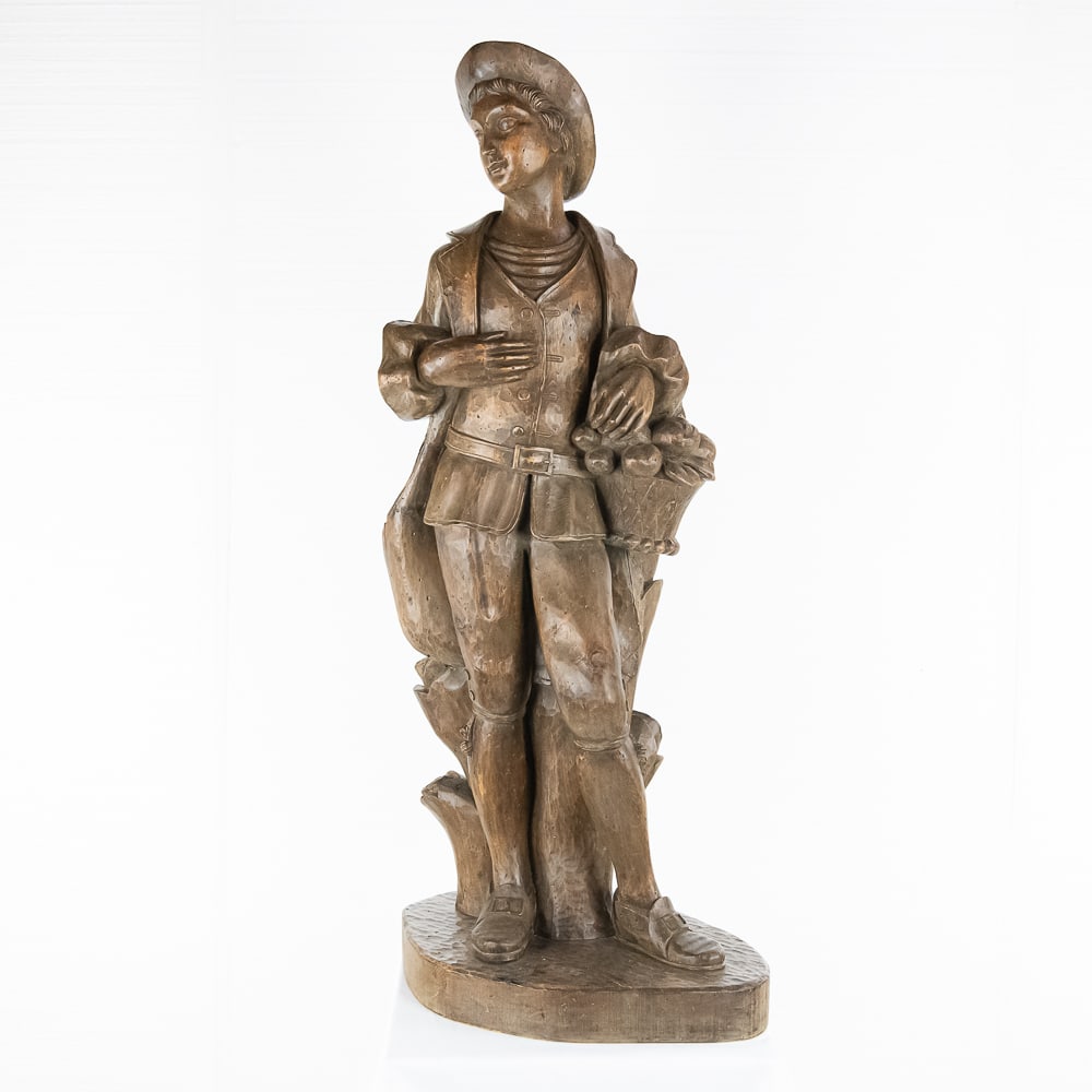Wood Carved Statue of an 18th Century Boy: *NO SHIPPING - PICKUP OR THIRD PARTY TRANSPORT ONLY* Contemporary wood carving of an 18th century standing boy holding a basket of fruit. Carving is well executed and probably of European origin. In V