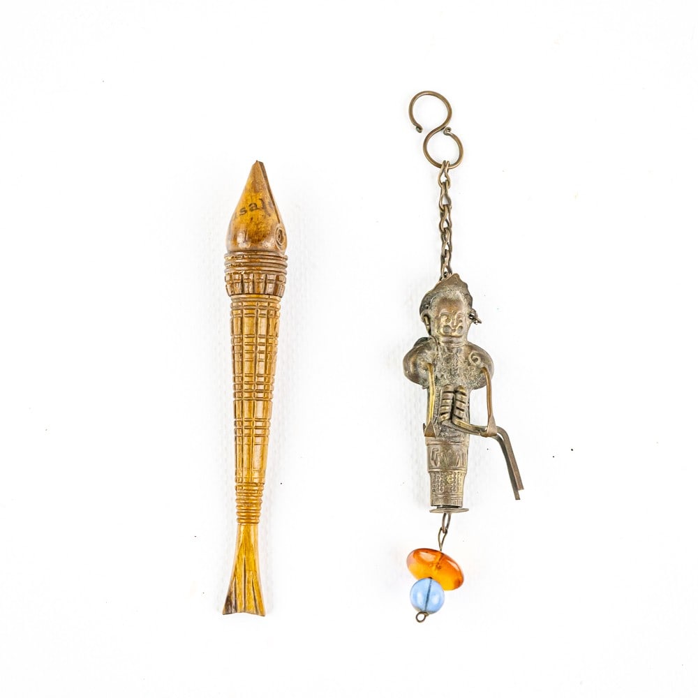 (2) Vintage Figural Sewing Needle Cases: Rare antique carved walnut fish figural shaped needle case & Antique Chinese silver repousse chatelaine God figural needle case. Both hard to come by needle cases are in good to very good overall cond