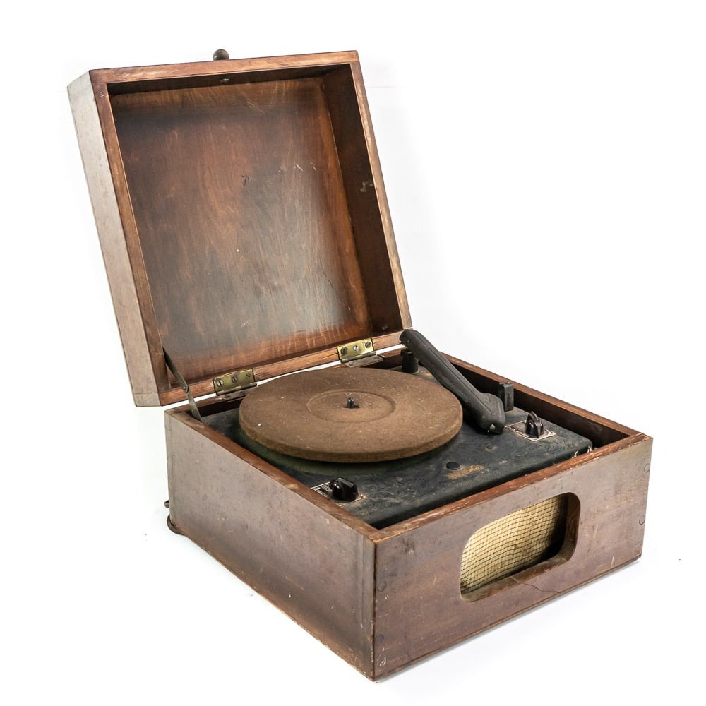 Trav-Ler 78 RPM Electric Phonograph: Early electric portable phonograph plays 78 RPM records using a changeable steel needle. In overall good cosmetic condition but needs a new power cord so it is untested. Housed in a home built wood ca