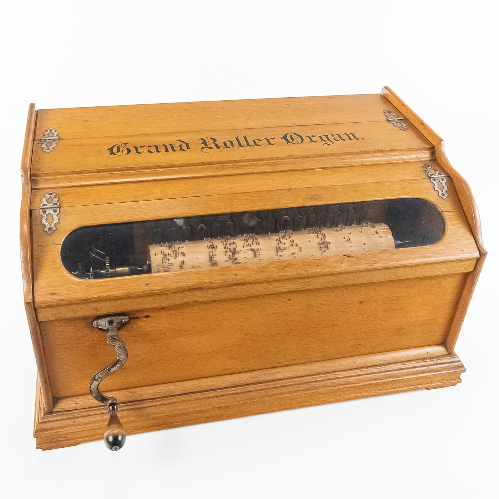 Grand Roller Organ by Autophone Company, NY: This large cob roller organ in its oak cabinet has its original golden oak finish and stenciling all of which are in exceptional above average original condition with a few minor scrapes and abrasions
