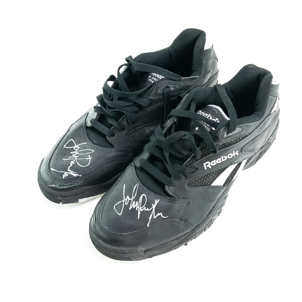 Pair of John Paxton Autographed Used Black Reeboks: Pair of used black Reebok cross trainers autographed by John Paxton. Both shoes are autographed with no size tag. Tag on shoe says "John Paxton 1994 Signed Game Shoes", no COA , display case included.