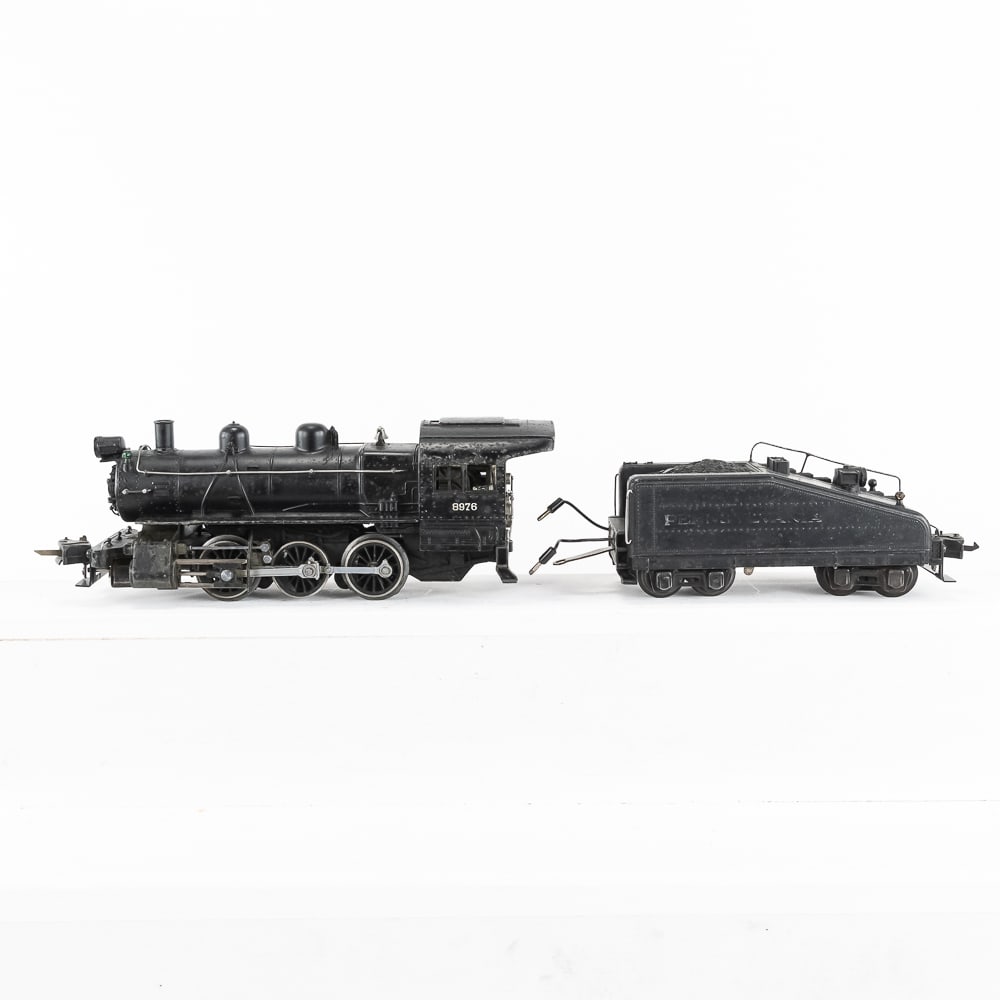 Lionel #8976 Switcher & #2228B Bell Ringer Tender: Scarce 1939-1941 Prewar Lionel O gauge #8976 steam engine switcher locomotive with matching #2228B bell ringer tender with Teledyne couplers. Pennsylvania barely legible on sides of tender. Good overa