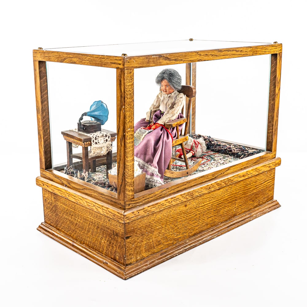 Unusual Automation Music Box: Professionally built. Not sure of the maker, but very well constructed. Wood case is quarter sawn oak and glass. Grandma is dressed in Victorian clothing, sitting in a rocker that rocks. Knitting a bl