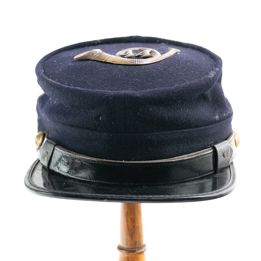 Civil War Union 44th Infantry Kepi-Larger Size: This Union kepi was clearly made in the mid to late 20th Century. However, the infantry bugle with 44 appears to from the CW period based on the production features, age and the solder used for the 44