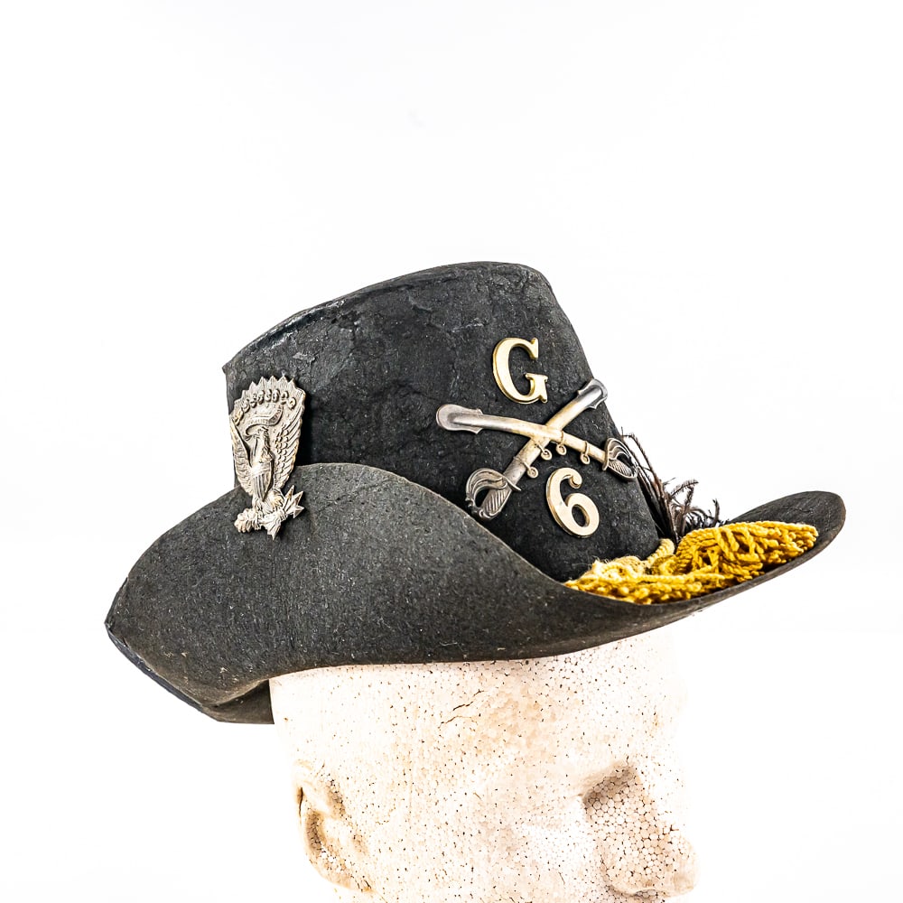 Fine Civil War Union M1858 Cavalry Hardee Hat: This restored hat stands 6" and has full brass insignia, chin-cord and ostrich feather. Brown leather liner with cross hatch pattern is complete. Lining has large label ink stamped "US Army Extra Manu
