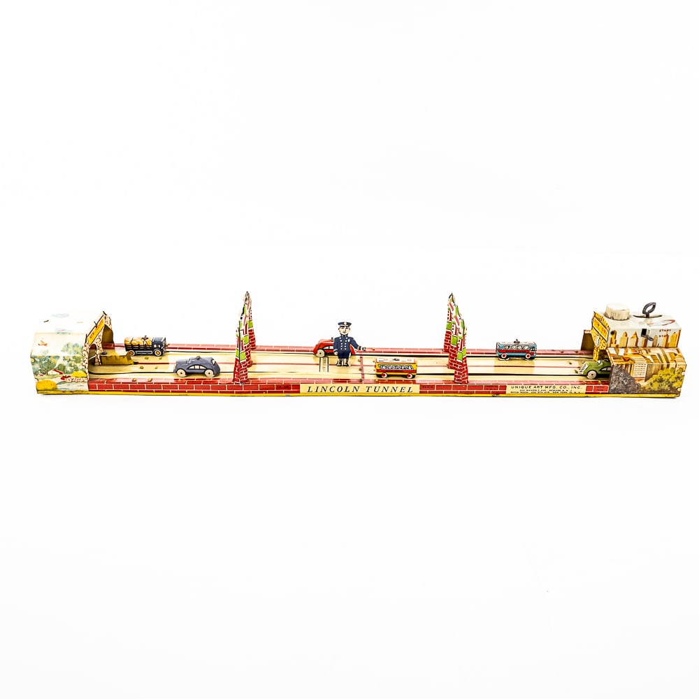 1930s Unique Art Lincoln Tunnel Tin Litho Toy: Hard to find 1930s Unique Art Mfg. company tin litho Lincoln Tunnel New Jersey to New York wind up toy. Very good overall condition with minor cosmetic imperfections including minor discoloration in a