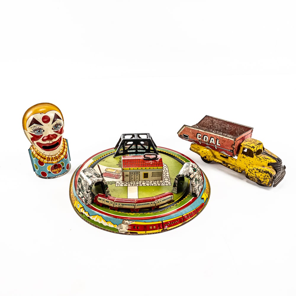 MARX Coke Coal Dump Truck Honeymoon Express Bank: Collection showcases MARX tin litho toy Coal Coke toy dump truck, MARX tin litho wind up Honeymoon Express Train (winds & runs) and J. Chein tin litho clown themed toy coin bank. Good overall conditio