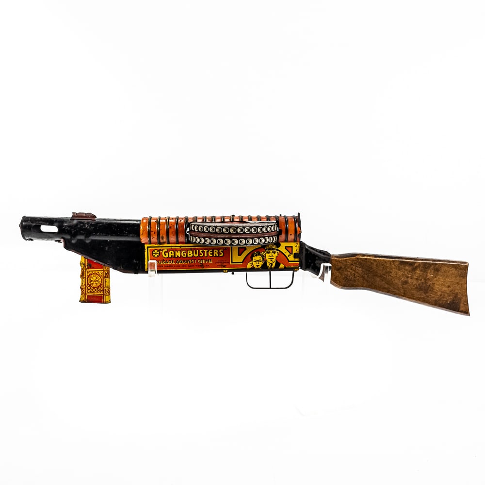 1940s MARX Gangbusters Toy Tin Litho Tommy Gun: 1940s MARX GANGBUSTERS Crusade Against Crime 24" long tin litho toy Tommy Gun. Good overall condition with some age and wear imperfections present including some discoloration, dings, scuffs & scratch