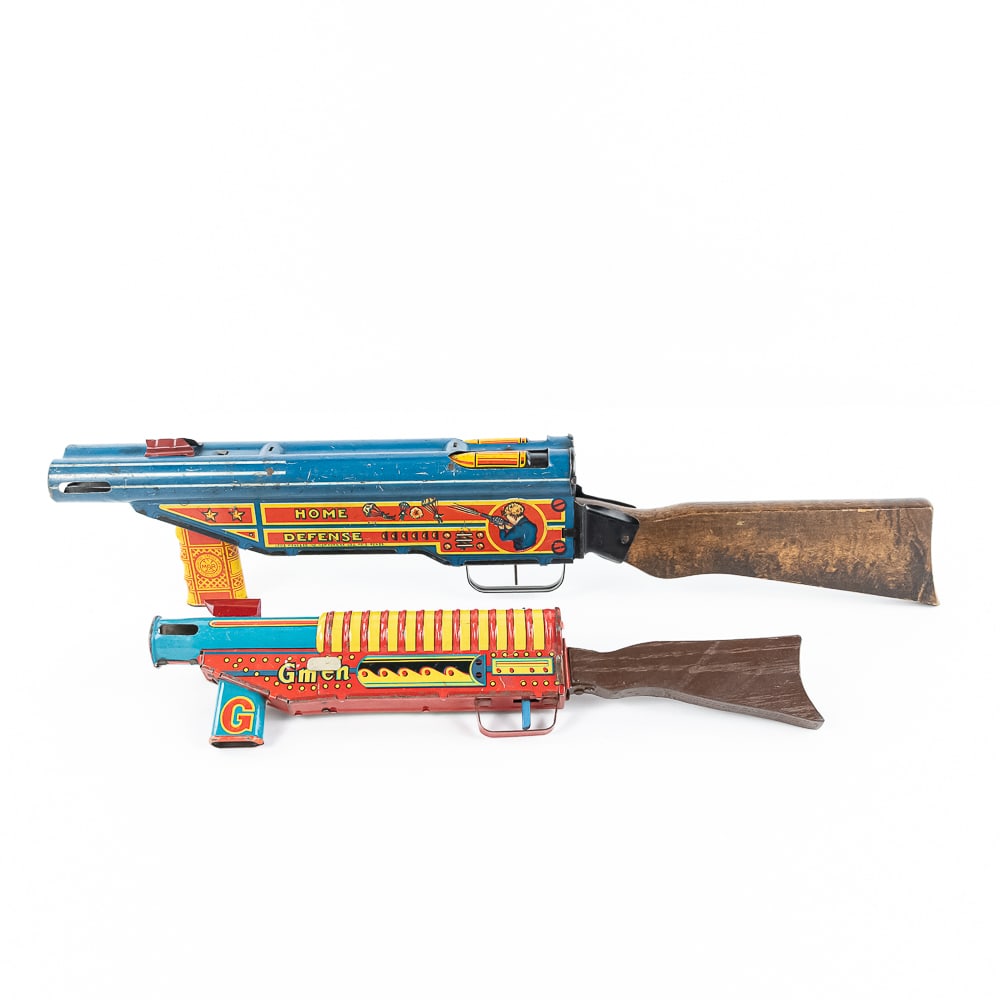 MARX Tin Litho Home Defense & G-Men Toy Guns: Collection features 22" MARX toy tin litho "Home Defense" shotgun and 14" MARX tin litho "G-Men" riffle. Both in good overall condition with cosmetic imperfections indicative of age and use including 