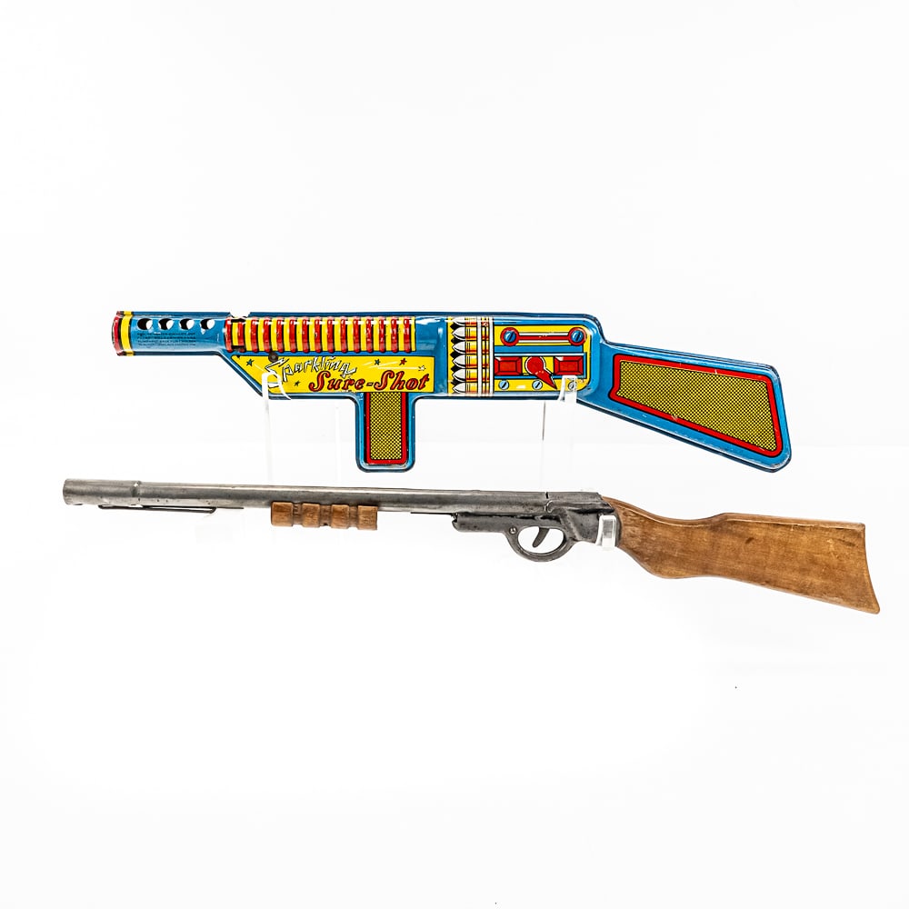 T. Cohn Tin Litho Toy Gun & Wyandotte R: Collection features T. Cohn 21" Sparkling Sure Shot tin litho toy gun and 22" Wyandotte toy shotgun. Both in good overall condition with some cosmetic imperfections indicative of age and use. Both wor