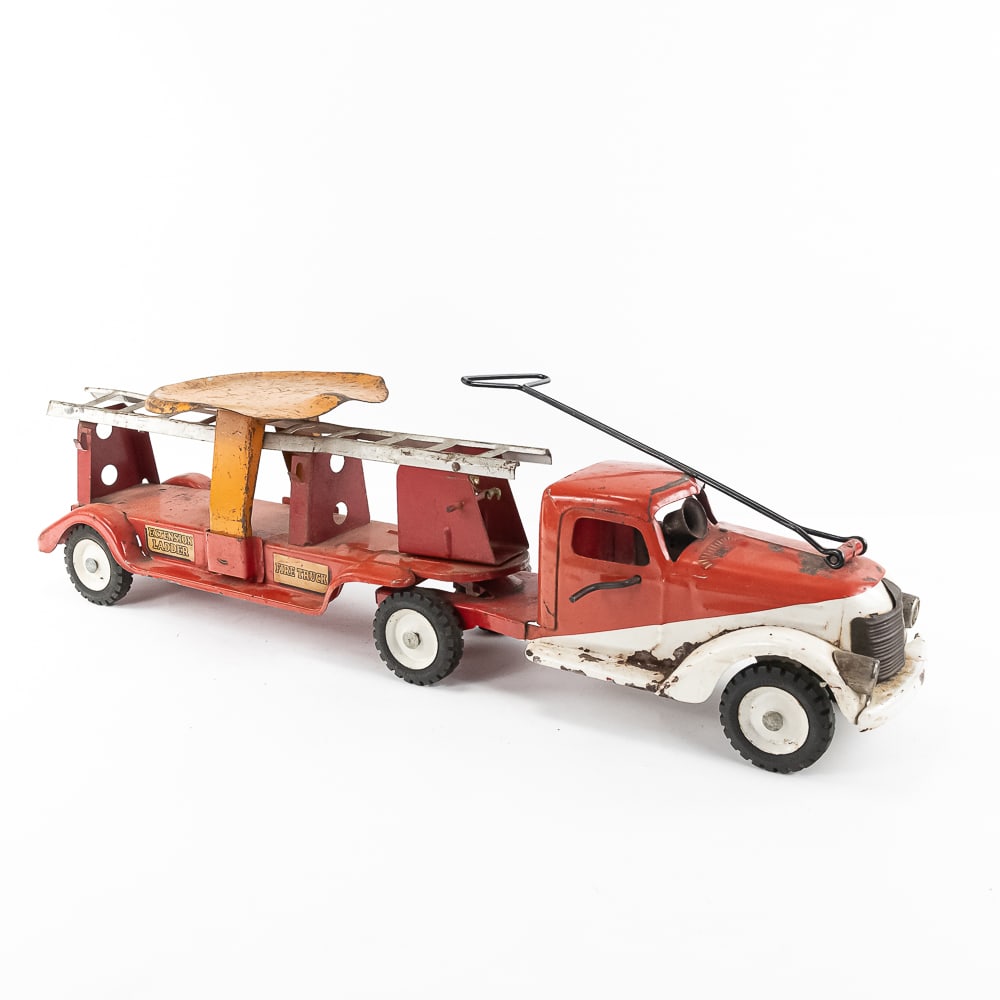 1940s Buddy L Extension Ladder Fire Truck Pull Toy: Hard to find Buddy L pressed steel ride on pull toy fire truck. Approximately 32" long and in good overall condition with moderate to heavy cosmetic imperfections associated with age and use including
