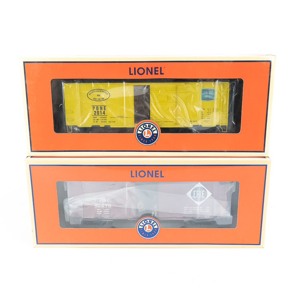 NIB Lionel 2226010 & 6-58571 Erie HOBO TCA Boxcar: NIB Lionwel 2226010 Erie HOBO boxcar with sound along with Lionel 6-58571 TCA Bethlehem Steel Scale PS-1 boxcar #2014. Both in excellent new overall condition; still showcased inside original packagin