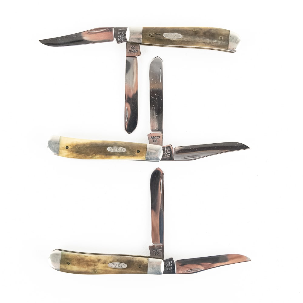 3 Case XX A6207 Mini Trapper Knives (1990s): 3 Case XX USA Model A6207SS Mini Trapper Knives. 1990s production knives are like new with only minor storage wear on bolsters. Very nice high quality US made knives with bone handles. Excellent colle