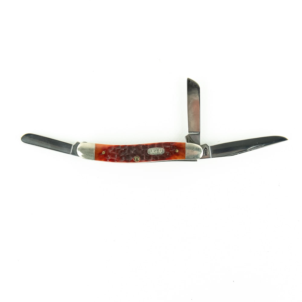 CASE XX USA Stockman 6318 CV, 3-Dot: Very nice, reddish jigged bone 3-blade Stockman. 3-Dot. Excellent overall condition with no flaws. Blades are clean with good snap.