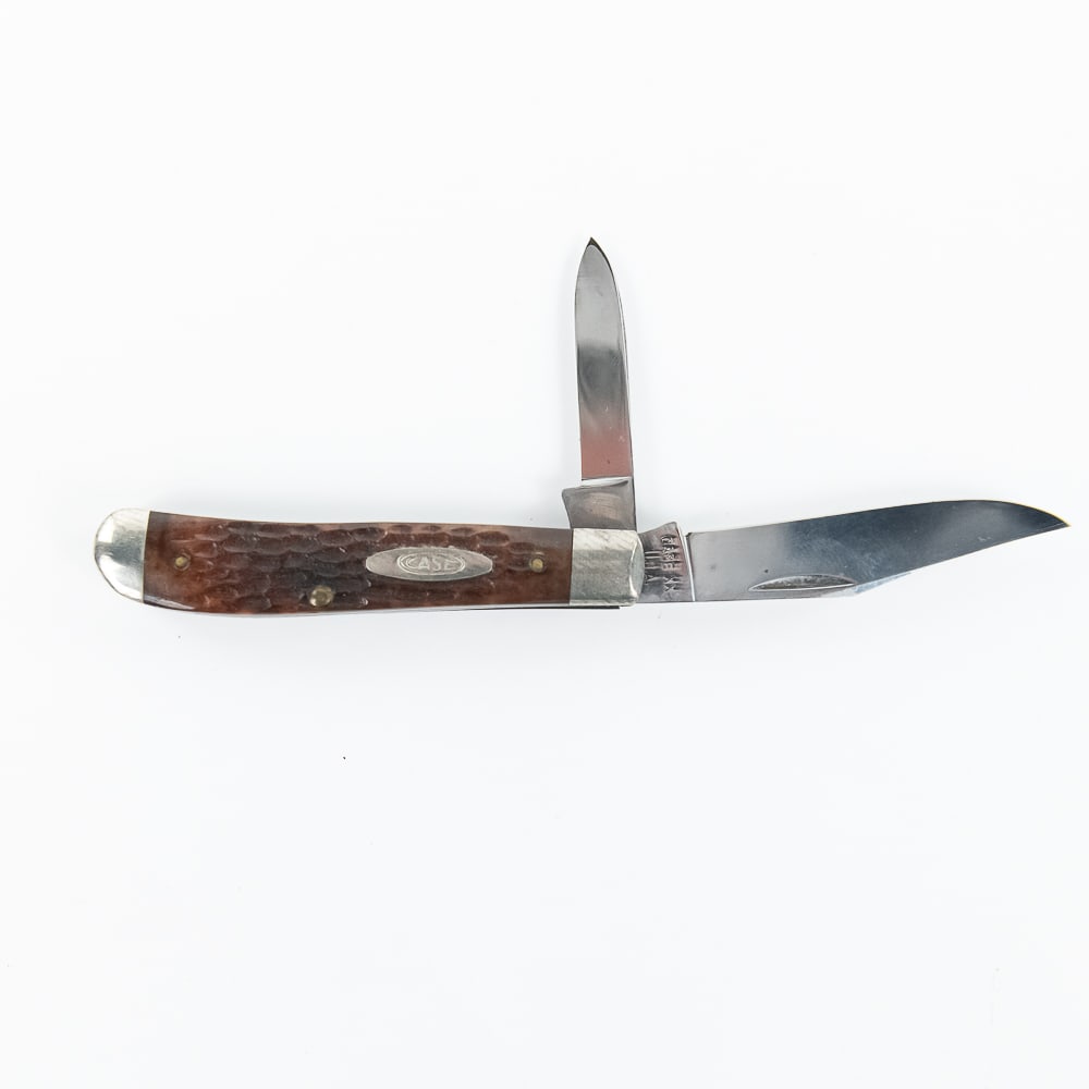 Case XX 6207 Mini Trapper Knife (1965-1969): Case XX Model 6207 Mini Trapper knife. Red Bone handle knife is like new with only storage wear on bolsters. Blades are still factory razor sharp. Vintage knife is date stamped for 1965-1969 on blade.
