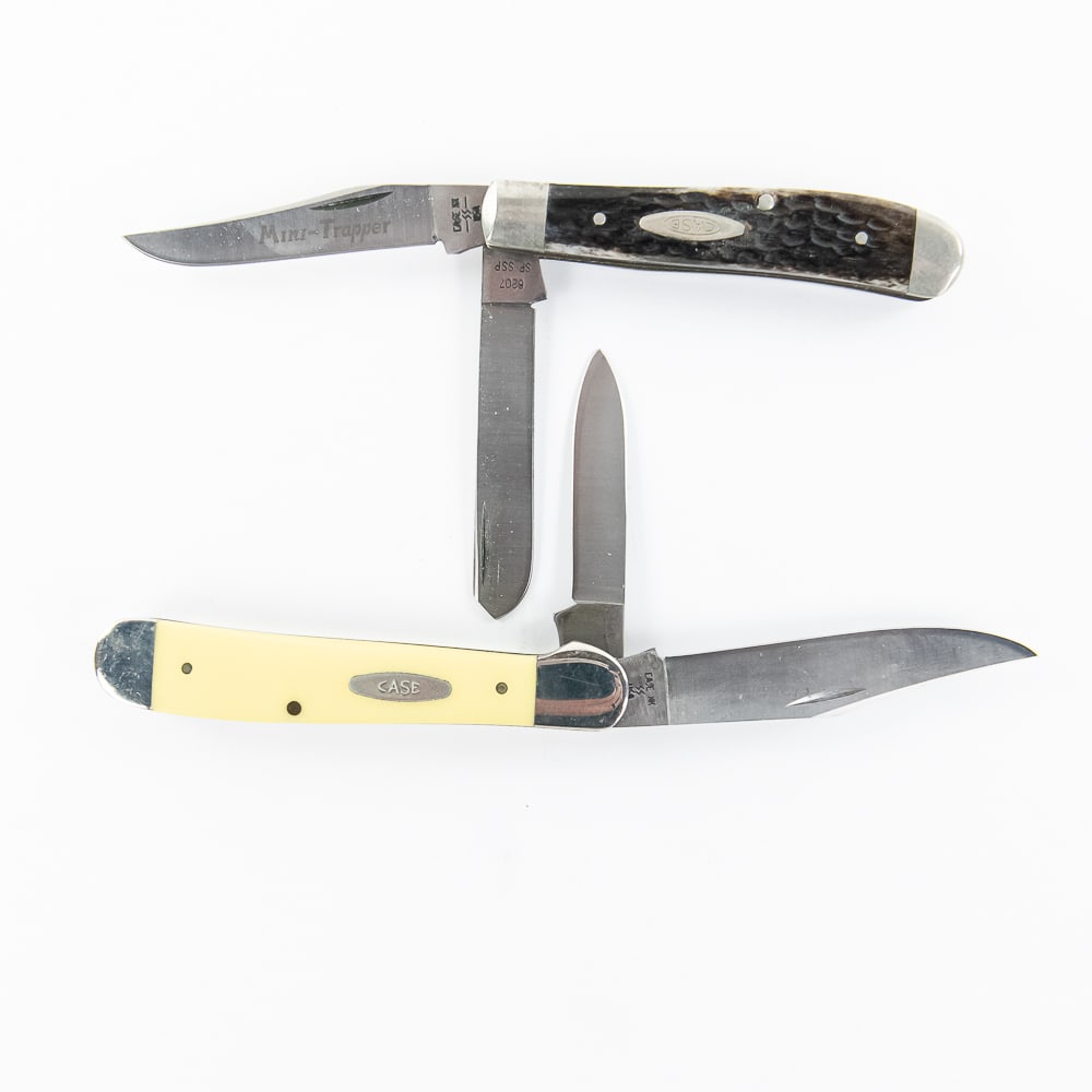 CASE XX USA Copperhead and Mini-Trapper: A nice pair of 80's CASE 2-blade folders. First is a Pat # 3249 SS Copperhead with yellow synthetic scales. Scales show good color and no cracks. Blades are great and have nice snap. Next is a MIni-Tr