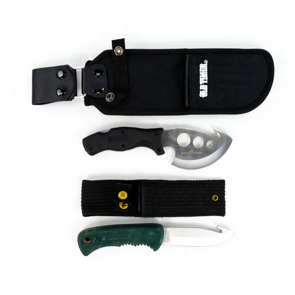 Schrade Old Timer Hunting Knife Set: Gut hook skinner knife with green handle is like new in nylon scabbard. Lot also includes Old Timer multi-blade skinning and field dressing tool that is like new with nylon carrying sheath. See photos