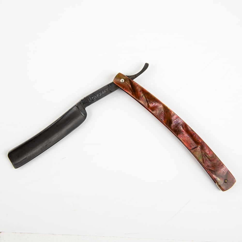 Shumate 311 Straight Razor: Vintage Straight Razor, "311" by Shumate Razor Co. Has a red-multicolored celluloid scales, with blank face in good condition. Tang reads "311 Shumate" and on the reverse, "Shumate Razor Co. St. Louis