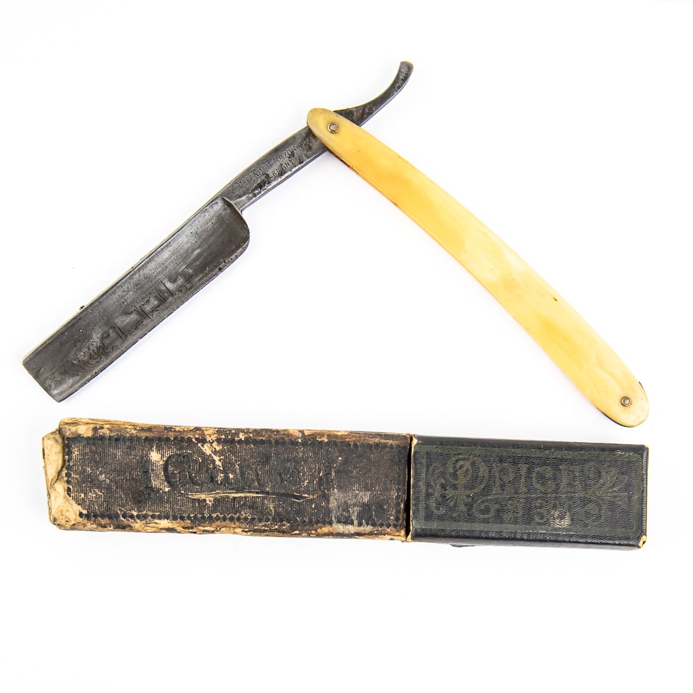 Defender Razor Co. Straight Razor w/ Unorig. Box: Vintage Straight Razor "202" by Defender Razor Co. Has bone-like scales. The face exhibits remnants of an engraved design, unable to determine what is used to be, and tang reads "Defender Razor Co. Ge