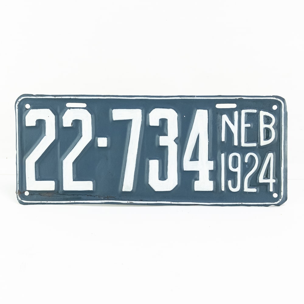 Nebraska 1924 License Plate: Nebraska. 1924, repainted on pitted plate in fair condition. Cleanly done. See pics.