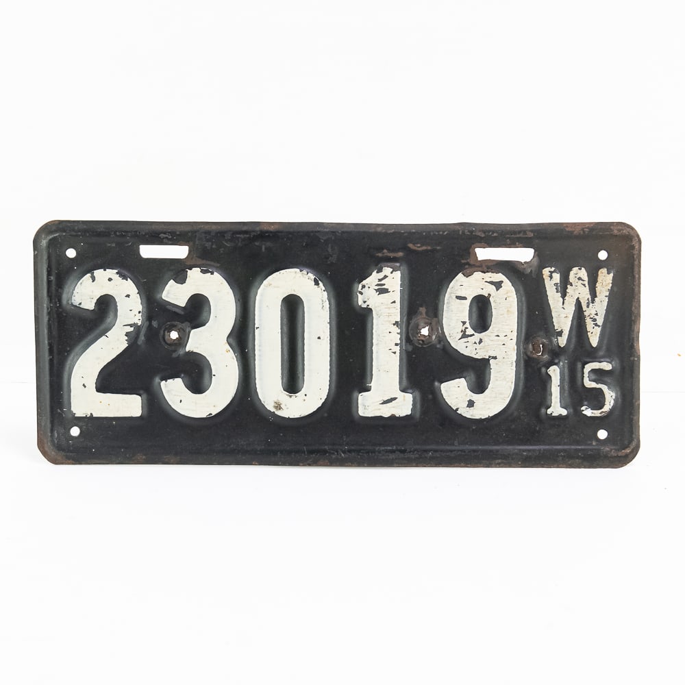 Wisconsin 1915 License Plate: Wisconsin 1915 in poor to fair original condition with light rust, dents along the top, and 3 extra holes punched along the horizontal centerline. See pics.