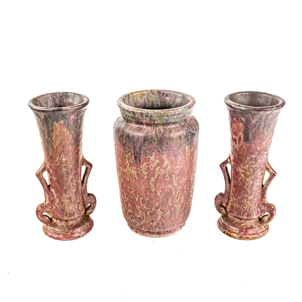 (3) Roseville Potter Carnelian II Pink Drip Vases: Collection showcases a pair of eye catching Roseville Carnelian II pink green mint drip 10" handled vases along with 11" pink green drop handless vase. One of the handled vases shows minor chip imperf