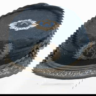 Post Civil War Union 49th Cavalry Officer Kepi Cap: This post Civil War kepi is full of character. It has an unknown cavalry insignia on the crown with metal cross swords on top of blue wool bordered in coiled wire on top of white wool scallop shaped d