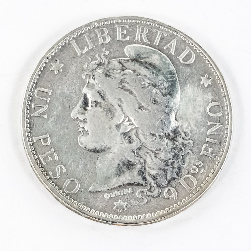 Scarce 1882 Argentina Un Peso Silver Libertad: 10% Buyer Premium + Online/Credit Card Fees if applicable on Coins & Currency Hard to come by (VF details?) 1882 Argentina Un Peso silver Libertad. Reverse looks better than obverse and almost appears