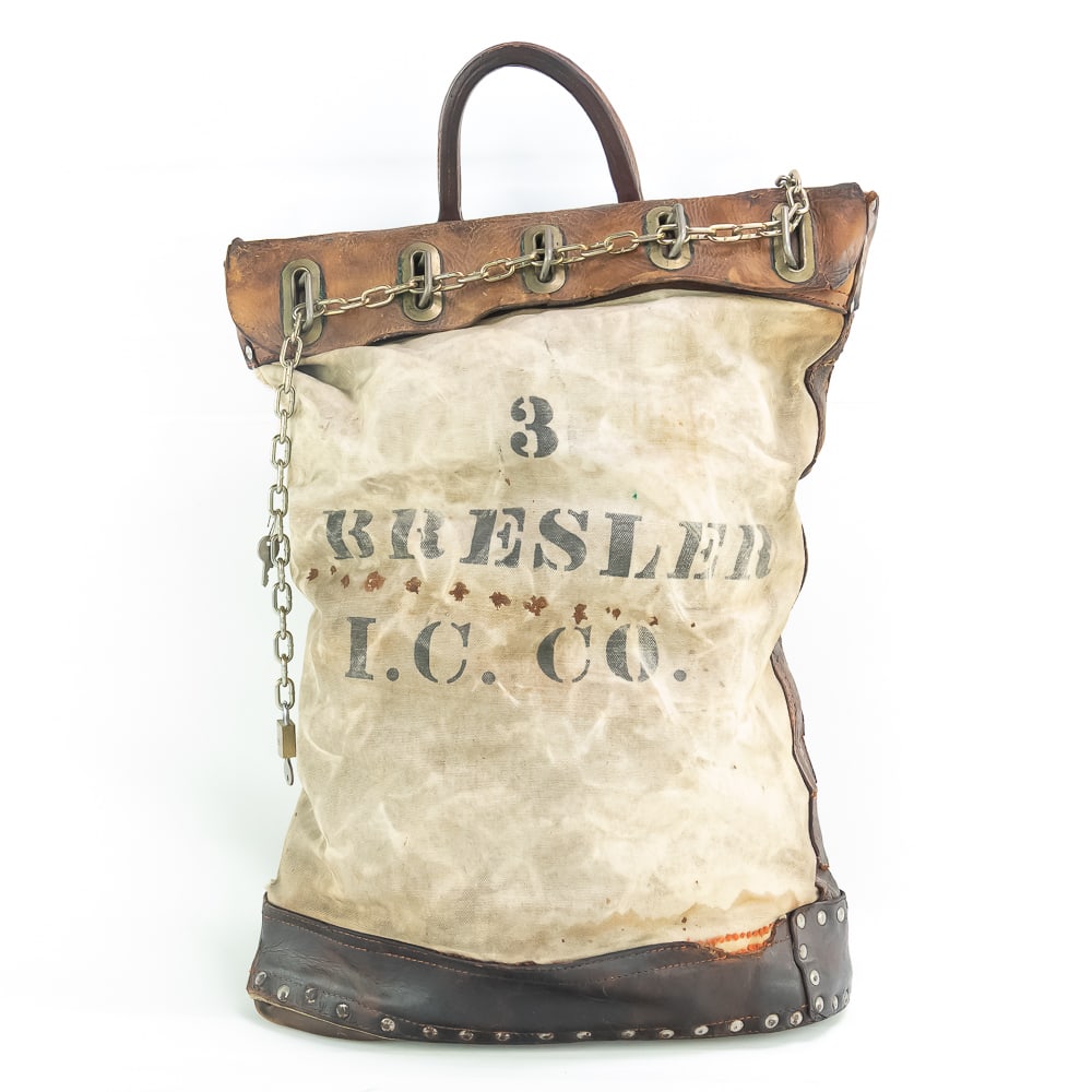 Antique Canvas & Leather Locking Courier Bag: Vintage heavy duty, made to withstand rough service courier bag. .This canvas and leather bag with rivets can be locked with a chain through the top buckles, This one belonged to the Bresler Company.
