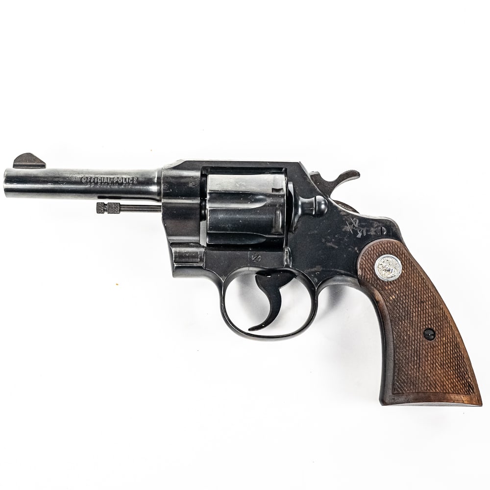 Colt Official Police .38spl 4" Revolver (C) 879307: Colt Official Police .38spl 4" Revolver in good condition with wear and oxidation. The bore is very good. MFG 1961 C&R Eligible S/N:879307