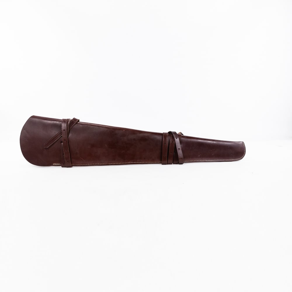 Triple K leather Rifle Scabbard: Triple K Brand USA made Leather Rifle Scabbard. Western style rifle Scabbard for saddle or rack carrying Rifle. Scabbard is 24" length for carbine or short shotgun. Scabbard is like new with only scra