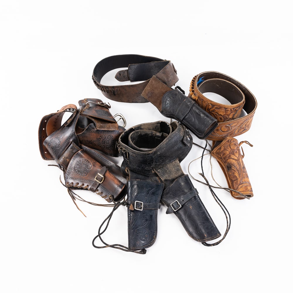 4 Leather Western Gun Belt/Holster sets: 4 Leather Gun holster and belt sets. 2 double gun rigs, 2 single gun. All are leather and in good useable condition, sized for 32-38 inch waists. See photos for details. Great for cowboy action shooti