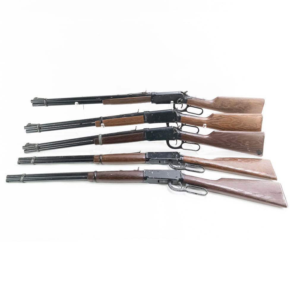 5 Daisy Western Lever Action BB Guns: 5 Daisy Western style Winchester 1894 replica BB guns. All are dinged, dented, and scratched from being used as movie and television props and stunt weapons. Some are missing small parts. Excellent de