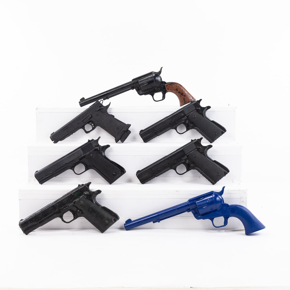 7 Resin Replica/ Movie Prop Handguns: 7 resin replica and movie prop hand guns. 2 Colt SAA revolvers and 5 1911 style handguns. 3 are Rings corporation heavy duty props. other ones are simple cast resin. One is rare screen practice copy o