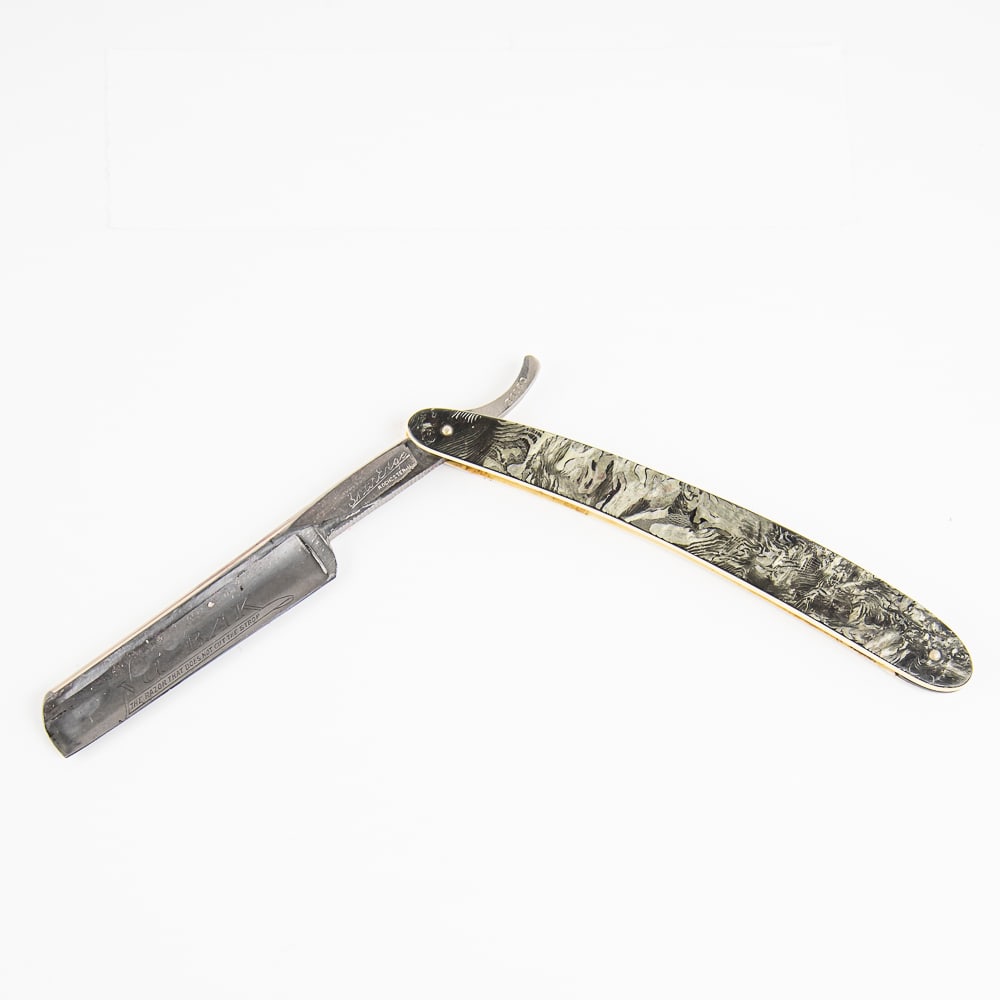 Robeson ShurEdge NU-B.AK Straight Razor: Vintage Straight Razor "ShurEdge" by Robeson, with white celluloid scales that have a black/grey reflective covering. The face reads "Nu-B.AK The Razor That Does Not Cut The Strop", Tang reads "Robeso