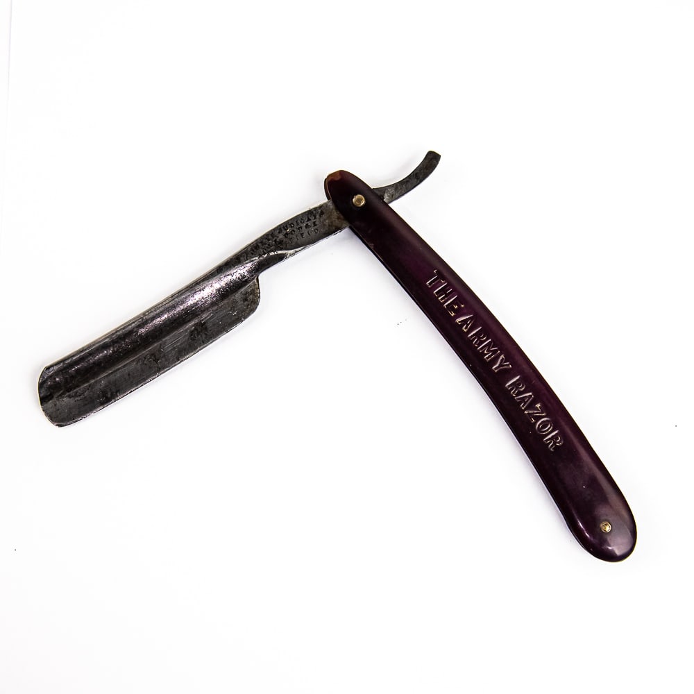 Juste Judicato J&R Dodge Straight Razor: Vintage Straight Razor "The Army Razor" by Juste Judicato J&R Dodge, with purple translucent plastic scales and "The Army Razor" pressed into side with faded gold-coloring. The face is blank, Tang rea