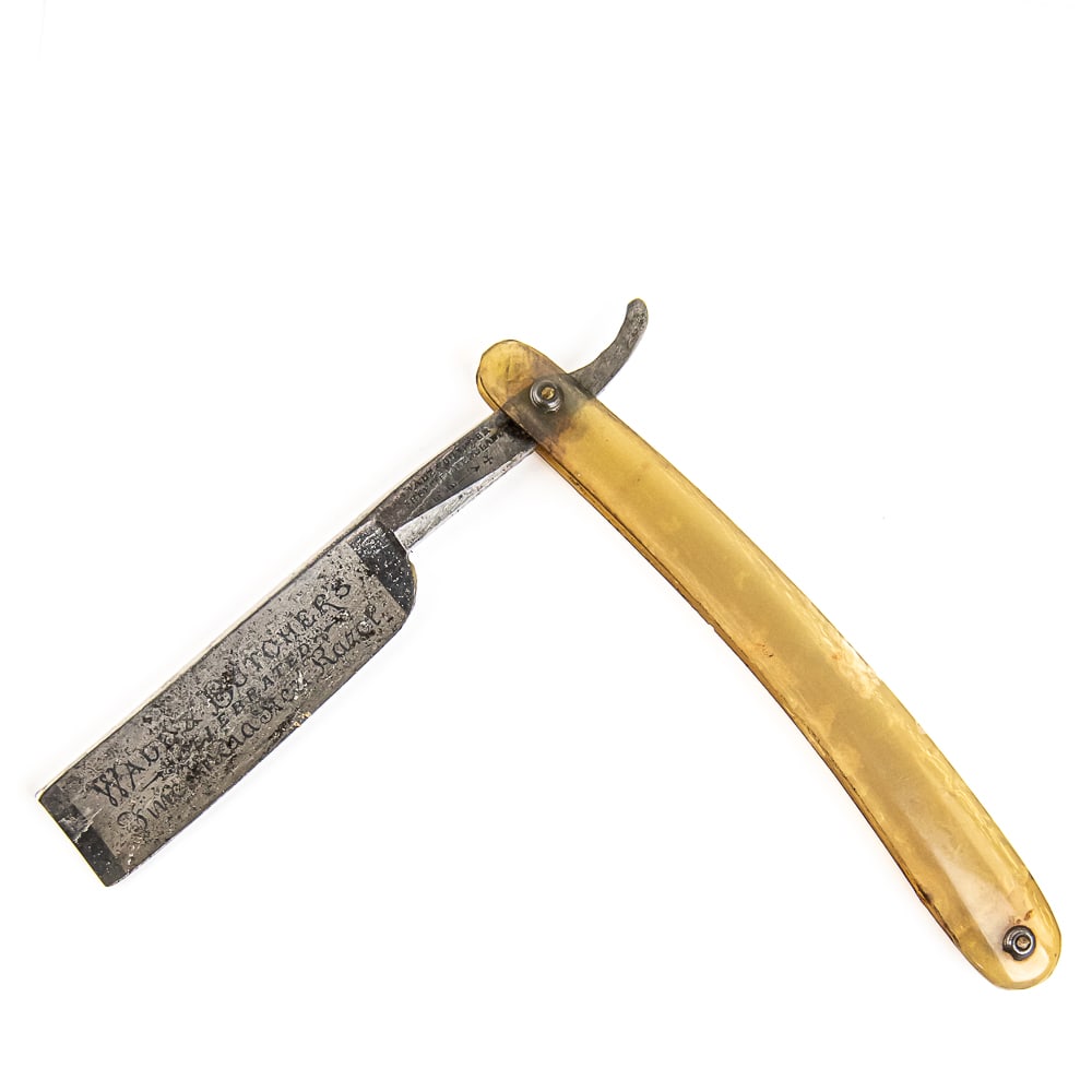 Wade & Butcher Celebrated Razor: *CONFIRM SCALE MATERIAL* Vintage Straight Razor "Celebrated Fine India Steel Razor" by Wade & Butcher, with translucent (HORN) scales that exhibit small chunks missing throughout. The face reads "Wade