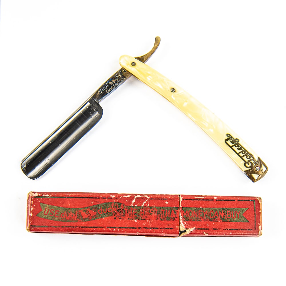 dubl duck Goldedge Razor w/ Box: Vintage Straight Razor "Goldedge" by dubl duck, with pearly celluloid scales with end cap pressed in at wedgepin, along with "Goldedge". The face is blank, Tang reads "dubl duck Goldedge" with logo, a