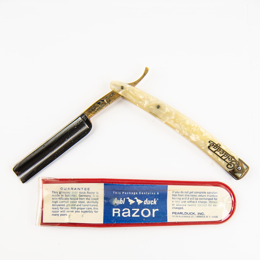 dubl duck Goldedge Razor w/ Original Pouch: Vintage Straight Razor "Goldedge" by Dubl Duck, with pearly scales that have "Goldedge" along with metal cap near wedge pin. The face is blank, Tang is golden colored and reads "dubl duck Goldedge" wi