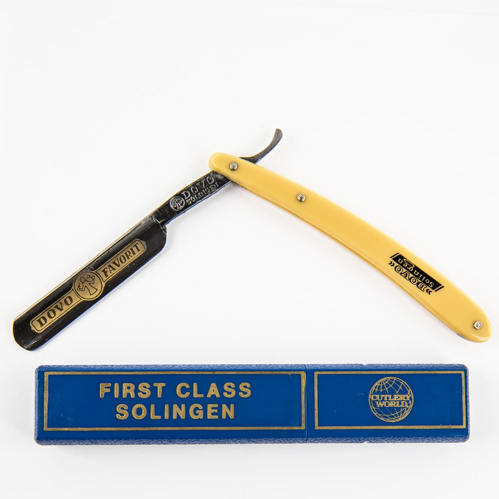 Fritz Bracht Dovo Favorit Razor w/ Box: Vintage Straight Razor "Dovo Favorit" by Fritz Bracht, with yellowed plastic scales with "Dovo Solingen" printed on side. The face reads "Dovo Favorit" with logo, and golden colored design, Tang reads