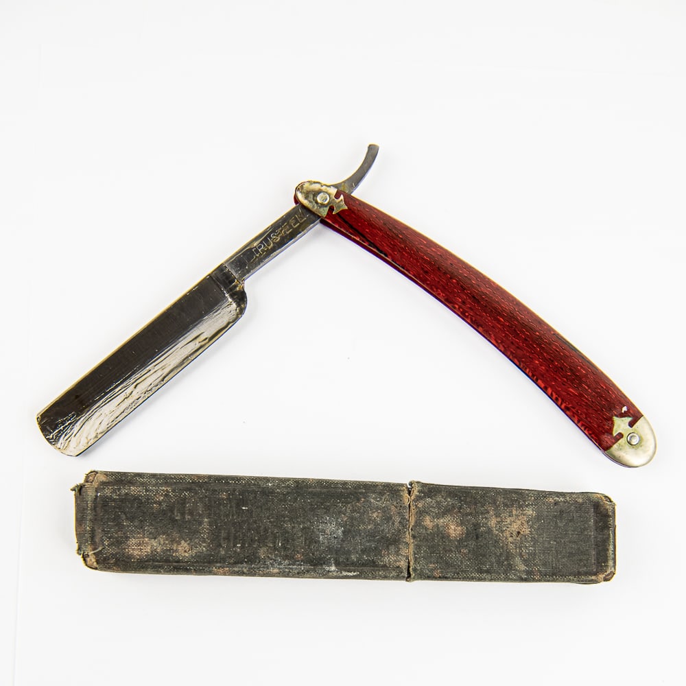 Trusteel Razor w/ Unorig. Box: Vintage Straight Razor "Trusteel", with faux-redwood scales, with metal caps at both ends that both have some tarnish. The face is blank, Tang reads "TRUSTEEL", and reverse is blank. Blade is in overa