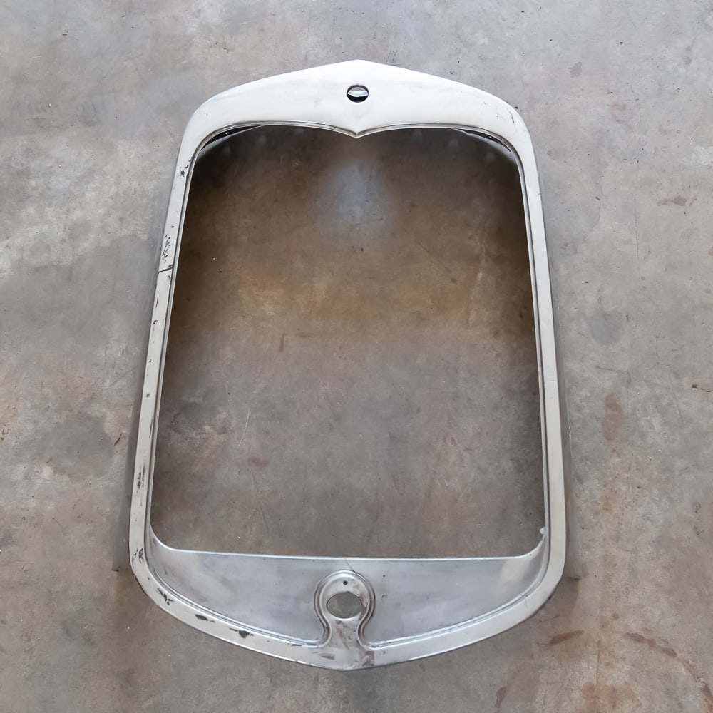 1930 Ford Model A Radiator Shell: Original, used stainless steel shell - missing Ford emblem and crank hole cover. In good condition